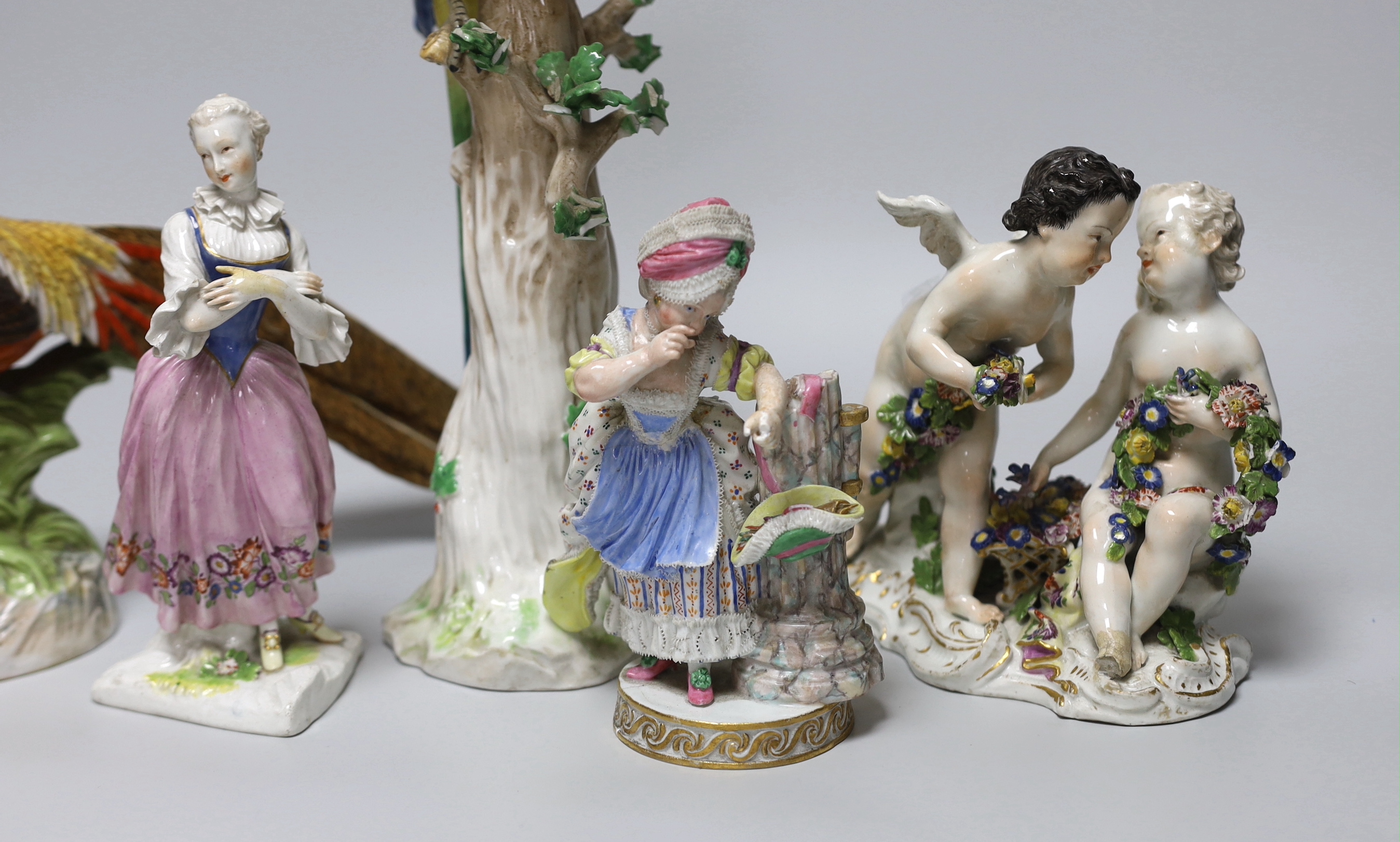 An 18th century Meissen figure group, 16cm, two 19th century Meissen figures, German cockatoo, and a Dresden asiatic pheasant